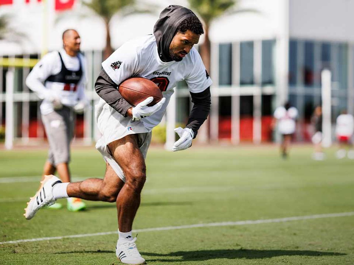 Emeka Egbuka runs with the ball during Tampa Bay Buccaneers practice