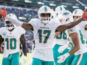 Jaylen Waddle (No. 17) celebrates with Tyreek Hill (No. 10) for the Miami Dolphins.
