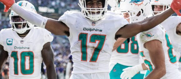 Jaylen Waddle (No. 17) celebrates with Tyreek Hill (No. 10) for the Miami Dolphins.