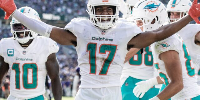 Jaylen Waddle (No. 17) celebrates with Tyreek Hill (No. 10) for the Miami Dolphins.