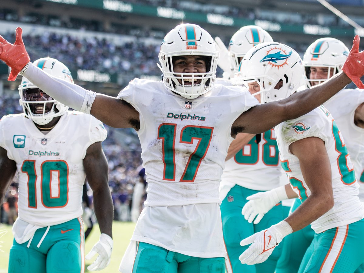 Jaylen Waddle (No. 17) celebrates with Tyreek Hill (No. 10) for the Miami Dolphins.