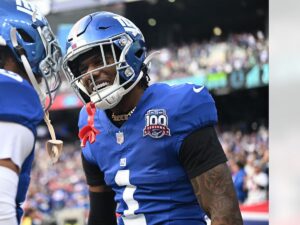 Malik Nabers celebrates in his New York Giants uniform during a game at MetLife Stadium
